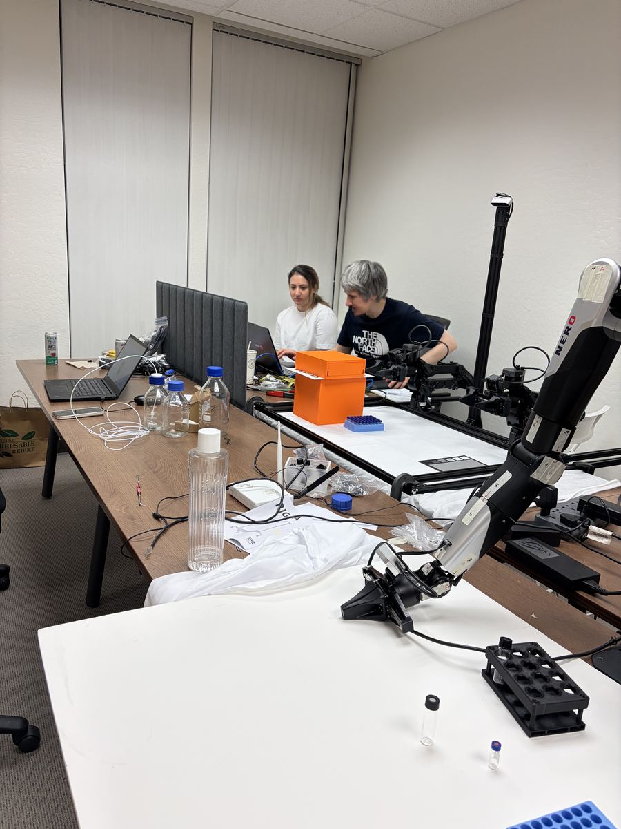 The working room with the robot rig, sample vials and laptops.